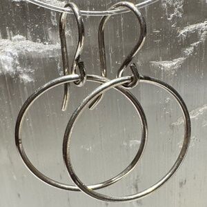 Delicate sterling silver sideways hoops. New!